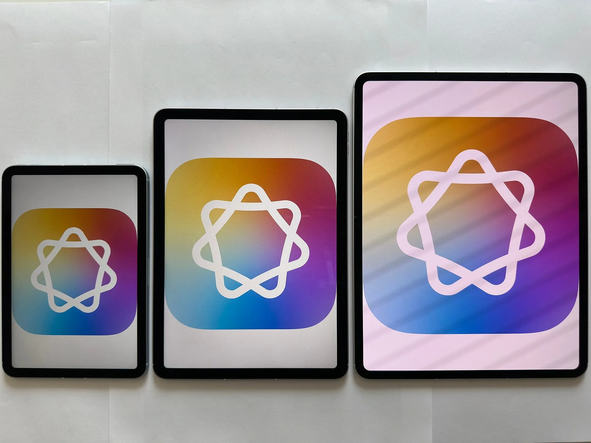 Apple Intelligence running on iPad mini, iPad Air and iPad Pro displayed together